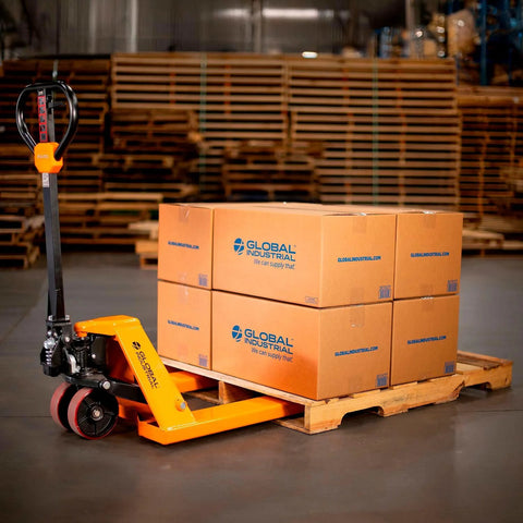 Pallet jack, Global Industrial orange, side view, lifting a pallet of four cardboard boxes.