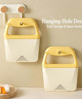 Pair of yellow-handled crinkle French fry potato slicers with blade covers; white bodies.