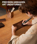 Person using Cordless Engraving Pen Kit With 5 Variable Speeds, Pro Grade Rechargeable Engraver Pen With 20 Bit Set on wood