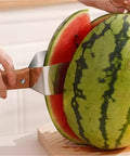 Triangular Watermelon Cutter With 304 Stainless Steel Blade slicing a watermelon