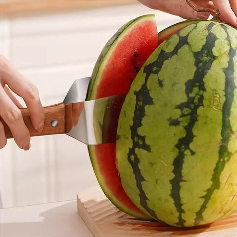 Triangular Watermelon Cutter With 304 Stainless Steel Blade slicing a watermelon