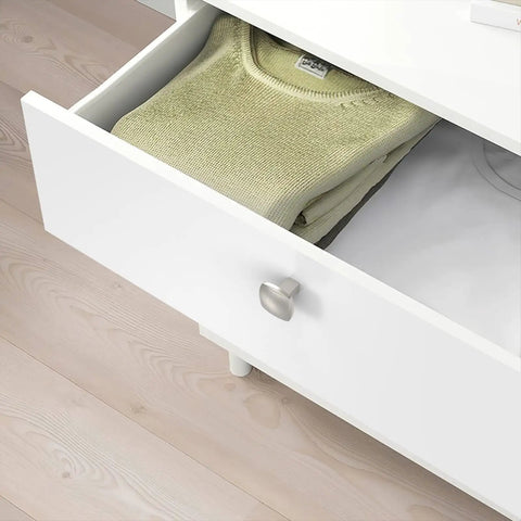Six Pack Brushed Satin Nickel Cabinet Knobs Zinc Alloy Kitchen Hardware Smooth As Silk Finish on white drawer with folded sweater.