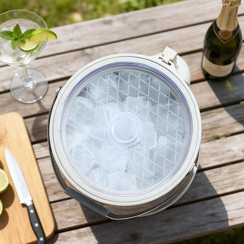 Keep It Frosty 4.8 Liter Insulated Ice Bucket With Snug Fit Lid And Drop Handle Scoop filled with ice on a wooden table.