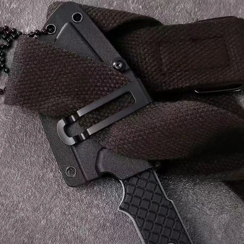 Mini Survival Knife With Sheath, Back Clip Whistle, And Multi Tool Build on textured surface
