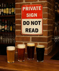 Funny Private Sign Do Not Read Tin Metal Wall Decor Vintage Rustic Distressed Hella Cool Art Piece for Man Cave Bedroom Bar Dorm Office Gift 12 by 8 Inch mounted above beer glasses.