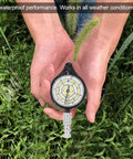 Rugged Mini Map Measuring Wheel For Dead Accurate Outdoor Distance Tracking And Trail Navigation Featuring Heavy Duty Alloy Build in hand outdoors.