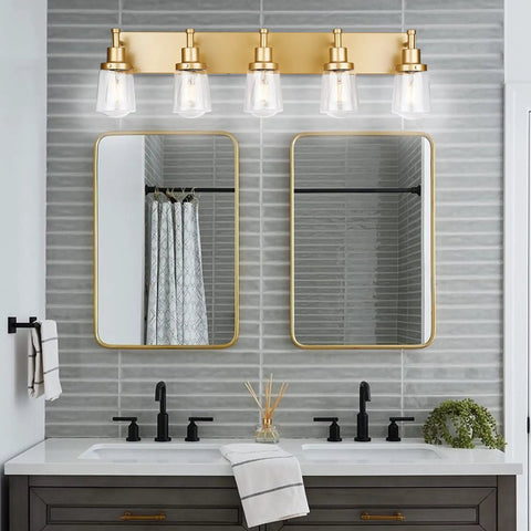 Gold Finish 5 Light Vanity Light Fixtures with Clear Glass Shades for elegant modern bathroom glow and ambience