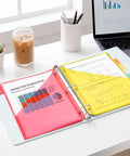 Eight Tab Dividers With Pockets For 3 Ring Binder placed on desk with colorful documents in pockets, dual pocket subject dividers letter size 8.5x11 includes 40 paper tabs bright color set ultra handy for school office and home use.