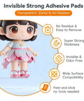 Super Grippy Removable Glue Dots For Diy Crafts And Home Decor Total Game Changer Formula Clear adhesive pads on a doll.