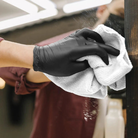Gloved hand cleaning a mirror with Bar Mop Towels Value Pack Of 60, 14 By 17 Inches, Absorbent And Durable Multipurpose Cleaning Rags, White