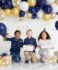 Children celebrating with Bold Navy Blue Gold Confetti Balloons Set 50 Pack 12 Inch Latex Balloons With Ribbon In Navy White Metallic Gold