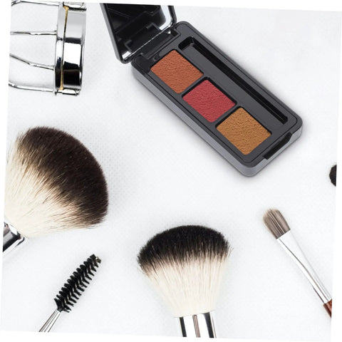 Dope New Compact Travel Makeup Palette With Mirror, Four Pack Empty Eyeshadow Containers For Portable Cosmetic Refills And Fly On The Go Beauty Organizers with three eyeshadow pans and brushes.