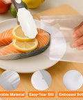 Pro Grade Precut Quart Vacuum Sealer Bags for Food, BPA Free 8 By 12 Inch, shown sealing salmon with lemons