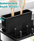 Close-up of stainless steel sink caddy with a sponge holder and brush holder, shown in modern black finish for kitchen countertop.
