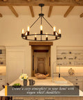 Black Wagon Wheel Chandelier Total Showstopper Lighting Fixtures Bring The Farmhouse Vibes To Your Dining Room Or Kitchen With This 9 Light Pendant hanging over a kitchen island.