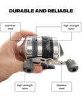 Close-up of a hand holding a Spincast Bowfishing Reel For Slingshot Bow Fishing Stainless Steel Construction with reversible handle