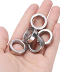 Top Shelf 5 Pack Heavy Duty 304 Stainless Steel Spacers held in hand, 5/8 Inch Inner Diameter, 7/8 Inch Outer Diameter, 1/4 Inch Long.