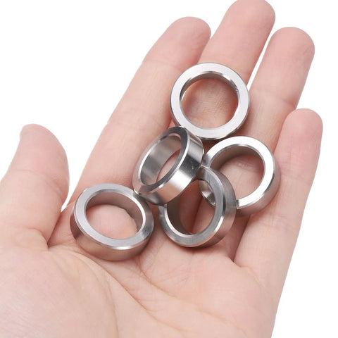 Top Shelf 5 Pack Heavy Duty 304 Stainless Steel Spacers held in hand, 5/8 Inch Inner Diameter, 7/8 Inch Outer Diameter, 1/4 Inch Long.