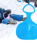 Blue Snow Sled For Kids And Adults, Downhill Toboggan Sledge For Winter Fun next to child sledding in snow