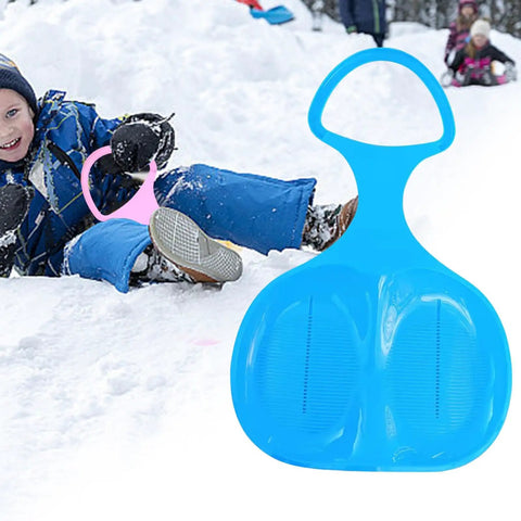 Blue Snow Sled For Kids And Adults, Downhill Toboggan Sledge For Winter Fun next to child sledding in snow