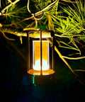 Portable Metal Table Lamp With 4000mAh Rechargeable Battery Cordless Outdoor Light hanging on a tree branch at night