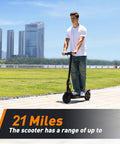 Person riding Long Range Electric Scooter For Adults Who Want To Cruise With 21 Mile Per Charge, 350W Motor, 18 MPH Top Speed