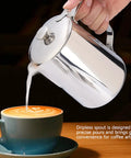 Stainless Steel Milk Frothing Pitcher With Lid And Dripless Spout 2000ml Pro Grade held pouring milk into latte art cup