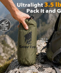 Big Ol 17x10 Ft Camping Tarp Shelter Waterproof UV-Resistant Rain Fly For Hammocks And Tents in compact carry bag on rocky surface