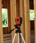 Self Leveling Cross And Line Laser Kit With GreenBrite Technology Green Beam For Indoor And Outdoor Use set up on tripod in construction site