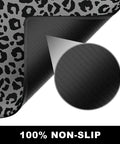 Extended Gaming Desk Mat XXL Full Coverage Mouse Pad For Huge Desks Black Leopard Print with non-slip base, close-up view.