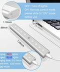 Charging Six Pack Wireless Under Cabinet Lights With Remote USB Rechargeable RGB LED Bar Kit next to laptop