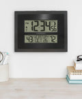 Digital Atomic Clock With Outdoor Temperature And Moon Phase Auto Time Sync Large Two Inch Digits Twelve Or Twenty Four Hour Display DST Auto Seven Time Zones No Fuss Setup Black Wall Or Desk Clock For Home And Office mounted on wall