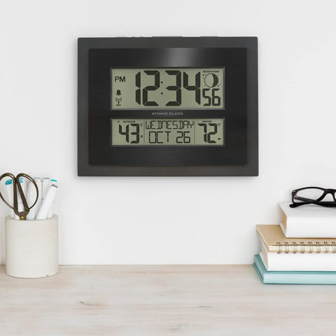 Digital Atomic Clock With Outdoor Temperature And Moon Phase Auto Time Sync Large Two Inch Digits Twelve Or Twenty Four Hour Display DST Auto Seven Time Zones No Fuss Setup Black Wall Or Desk Clock For Home And Office mounted on wall