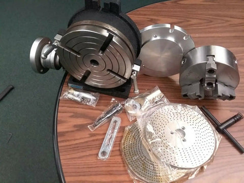 8 Inch Precision Horizontal Vertical Rotary Table With 6 Inch Three Jaw Chuck and tools on wooden surface.