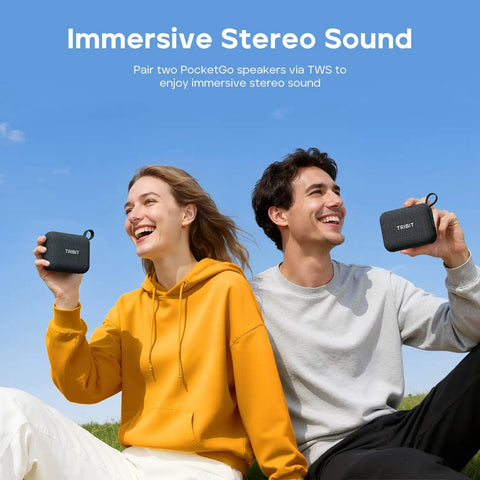 Two people outdoors holding PocketGo Bluetooth Shower Speaker With IP68 Waterproof And Dustproof Rating, 20 Hour Playtime.