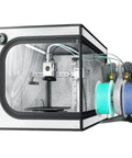 Enclosed 3D Printer Enclosure With Built In LED Lighting And Constant Temperature Design For Stable Printing Reducing Warping And Shrinkage Across PLA PETG ABS And Other Materials, showing printer setup and filament spools