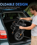 Man placing Foldable Electric Bike For Adults And Teens With 740W Peak Motor 48V 10Ah Removable Battery into car trunk