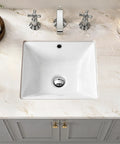 IBVIVIC Undermount Bathroom Sink, 14.4x12.7 Inch White Rectangle Porcelain Ceramic Vessel Sink, Deep Basin with Overflow - Under Counter Lavatory Vanity Sink for Home & Hotel on marble countertop.