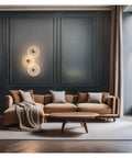 LMAPLUMP Wall Lamp Wall Sconce Modern Artistic Luxury Iron Textured Ripple Glass Light 3-Light Cluster LED above cozy sofa in living room.