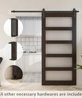 36 Inch By 84 Inch Glass Barn Door With 6.6 Foot Sliding Door Hardware Kit Included And Handle Five Panel Frosted Glass Solid Wood Slab With Waterproof PVC Surface For Privacy And Durability Pre Drilled For Easy Assembly Brown shown installed in a modern room.