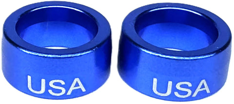 Two blue anodized aluminum steering wheel column sleeve bushings with USA engraving.