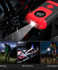 All In One Portable Tire Inflator And Jump Starter Kit With LED Light, Auto Stop, And Pressure Gauge in use at night.