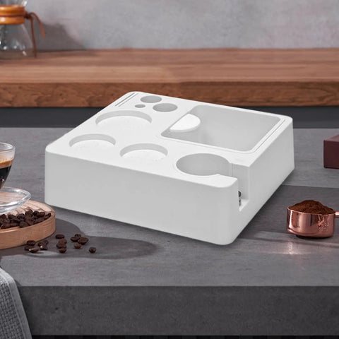 Heavy Duty Coffee Tamper Station With Pop Out Grounds Container, Clean White Espresso Tamping Holder For Home Bars on countertop.