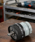 Close-up of Dual Self Locking Brushless Gearbox Replacement With 13 Tooth Metal Gear Assembly on workbench.