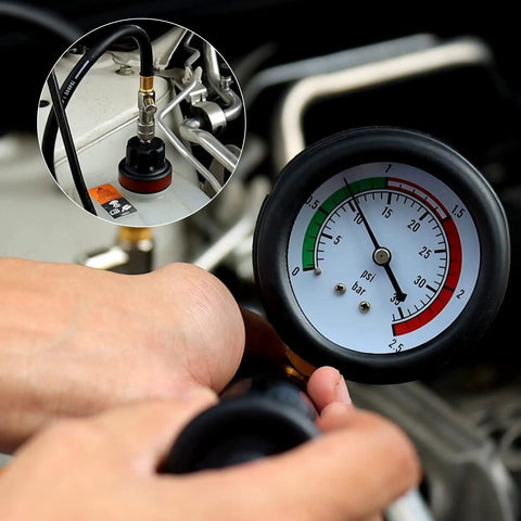 Close-up of Streetwise 14 Piece Coolant Pressure Tester Kit With Manual Pump, showing gauge and hand holding hose.