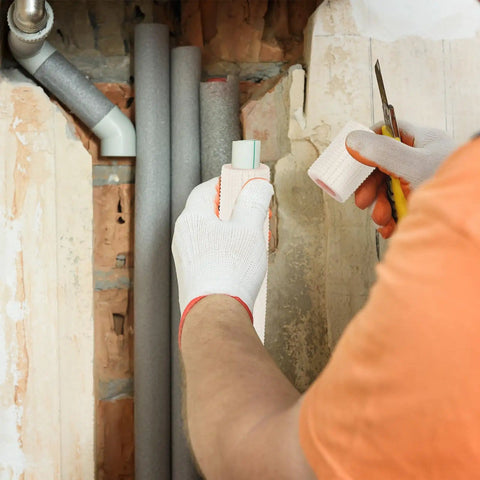 Person installing pipe insulation foam tube for copper pipes one quarter inch and three eighth inch OD 9.84 feet