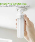 Hand inserting Four Pack 13 Watt Double Tube 2 Pin GX23 2 Plug In CFL Bulb 4100K Cool White Replacement For GX23 2 Sockets into fixture