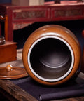 Hella Durable Ceramic Cereal And Rice Dispenser With Seamless Airtight Lid, showing an open brown ceramic storage jar on a wooden table.