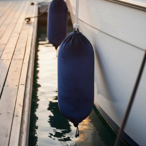 Keep Your Boat Spotless At The Dock With This Inflatable Fender Velvet Hull Protector hanging securely on a boat.