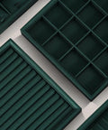 Top Tier PU Leather Jewelry Display Tray Featuring Twenty Four Secure Grid Slots For Rings Earrings And Brooches, dark green with various slot designs.